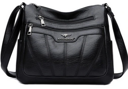 Bolso de hombro negro de estilo urbano con asa ajustable