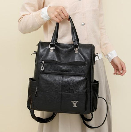 Mochila de piel de mujer negra con asa de hombro