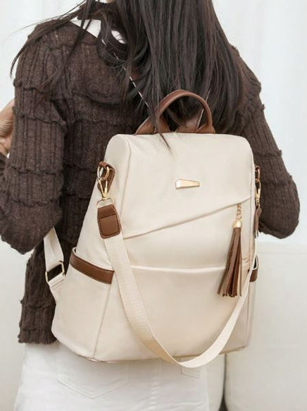 Mochila de tela de mujer en beige con detalles en marrón